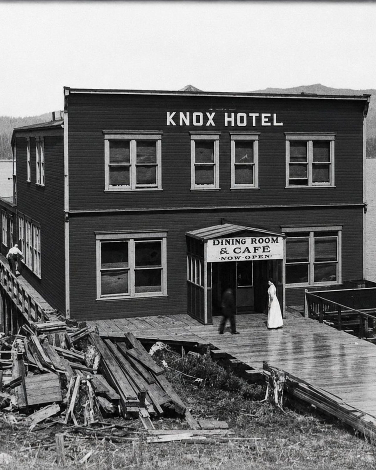 Archival black-and-white photograph of the original waterfront Knox Hotel, with its Dining Room and Cafe entrance, the building that today houses OV Burger Bar in Prince Rupert, BC